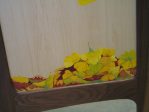 A pile of fallen leaves on the reverse side of the panel.